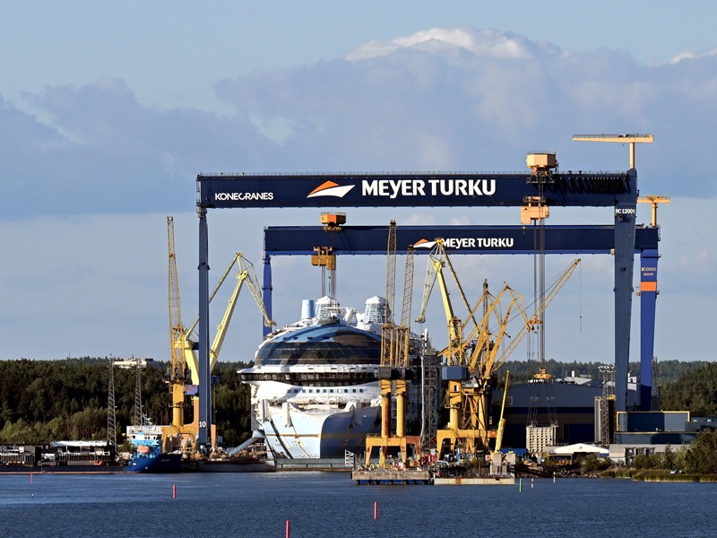 Gantry cranes and shipyard cranes surrounded a cruise ship at Turku Shipyard on 14 August 2024.