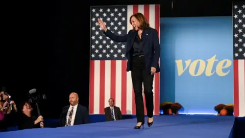 Democratic presidential nominee U.S. Vice President Kamala Harris waves during a campaign event in Green Bay, Wisconsin