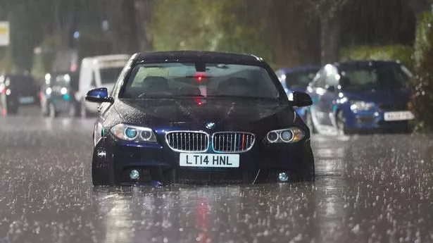 Cars were left abandoned after becoming stuck in flood water